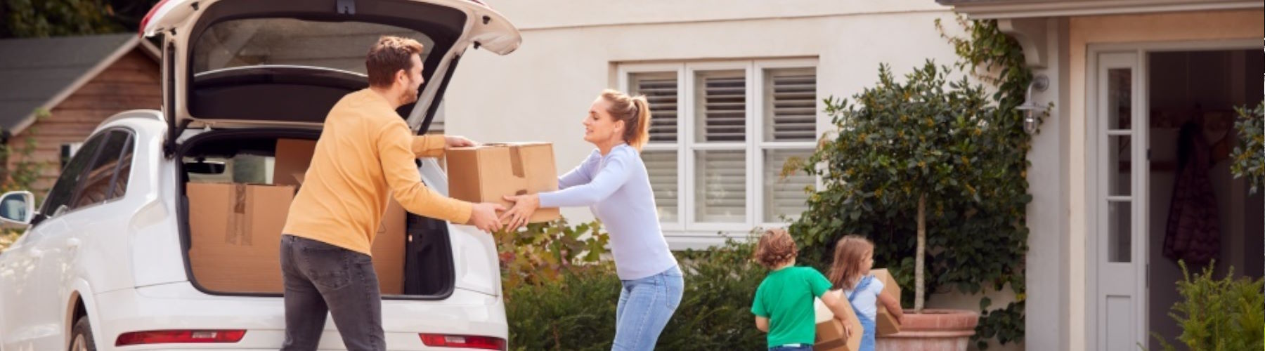 Home insurance represented by family moving in